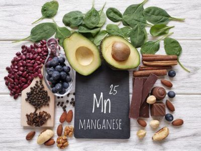 Manganese supplement capsule on a white background, sports nutrition